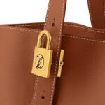 LOUIS VUITTON LOW KEY CABAS EMBLEM LEATHER TOTE IN COGNAC
